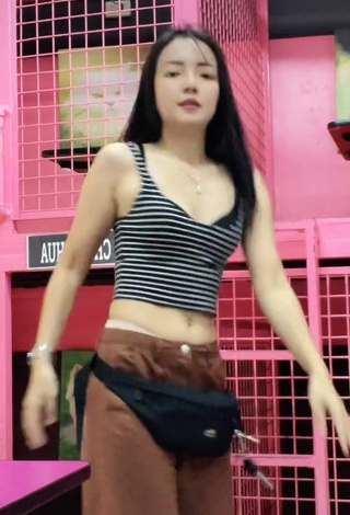 1. Irresistible Rosemarie Tan in Striped Crop Top