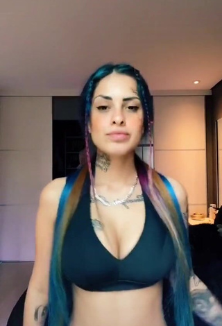 Irresistible MC Tati Zaqui Shows Cleavage in Black Sport Bra