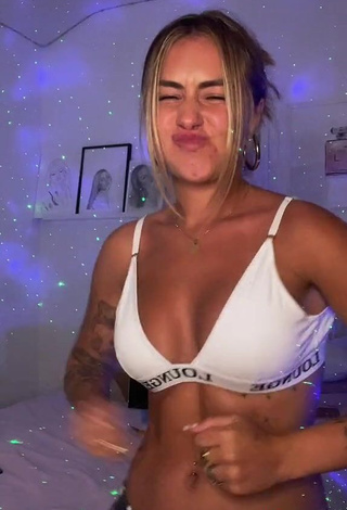 Cute Abril Cols Shows Cleavage in White Sport Bra