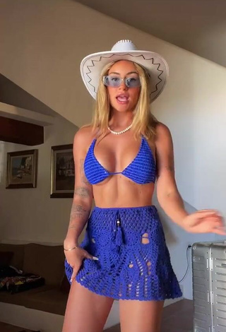 2. Irresistible Abril Cols Shows Cleavage in Blue Bikini Top (Underboob)