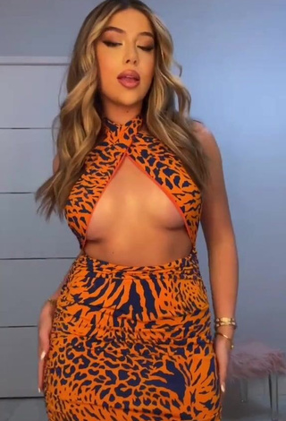 1. Captivating Amanda Díaz in Leopard Dress (Underboob)