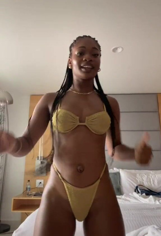 Captivating Angel Ogbonna in Golden Bikini