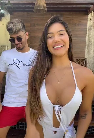 Captivating Ayarla Souza Shows Cleavage in White Swimsuit