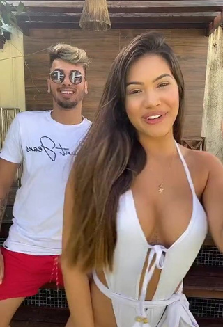 3. Captivating Ayarla Souza Shows Cleavage in White Swimsuit