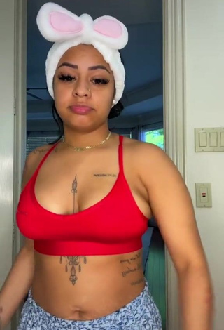 Erotic Carmen Pritchett Shows Cleavage in Red Sport Bra