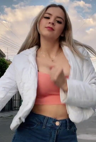 Amazing Carol Castro Shows Cleavage in Hot Peach Crop Top